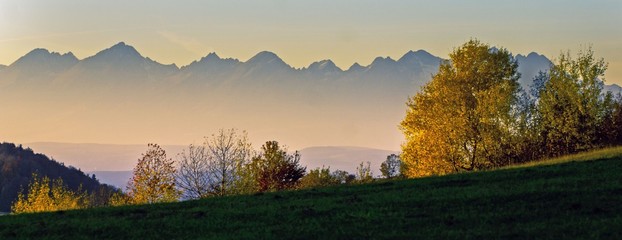 A picturesque landscape comprising of mountains and greenery