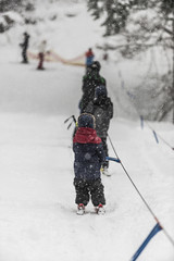 children's ski lift at a ski resort - obrazy, fototapety, plakaty
