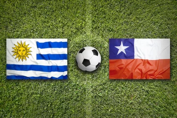 Papier Peint photo Foot Uruguay vs. Chile flags on soccer field