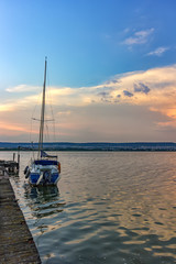 Beautiful light composition and mood of the boat at sunset