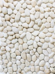 Neutral pattern of beige stones. Flat lay, top view