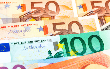 Background from different euro banknotes close up