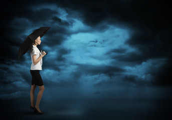 Businesswoman with umbrella