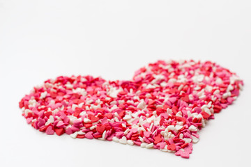heart made of many little hearts white pink and red. festive background for Valentine's day, birthday's, holiday