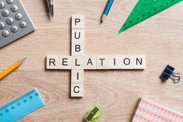 Conceptual business keywords on table with elements of game making crossword