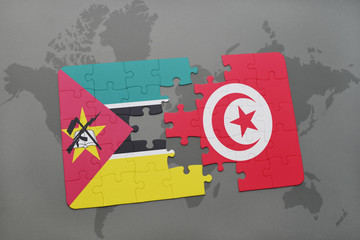 puzzle with the national flag of mozambique and tunisia on a world map