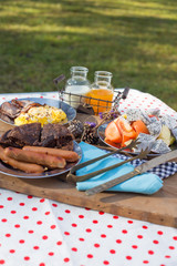 Various breakfast table with fruits egg and sausage, orange juice and milk