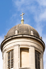 Fototapeta na wymiar Cross On The Georgian Dome Against Blue Sky
