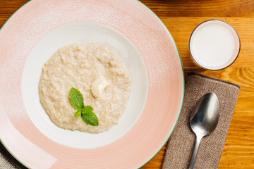 oatmeal with butter and mint in a plate