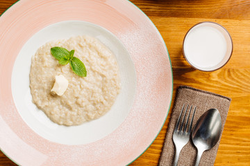 oatmeal with butter and mint in a plate