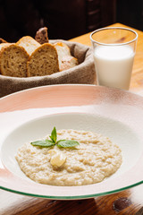 oatmeal with butter and mint in a plate