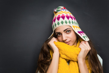 Woman with yellow scarf posing