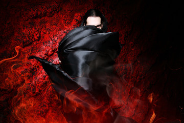 beautiful vampire man in the black coat - obrazy, fototapety, plakaty