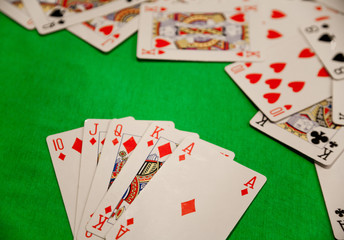 royal flush poker cards combination on green background casino game fortune luck