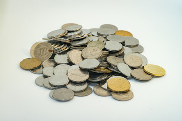 Pile of silver and gold colour of Malaysian coins with white background