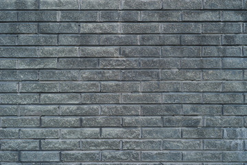 Gray brick wall texture. Background with copy space.