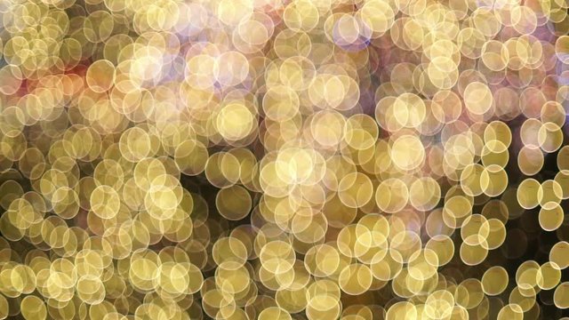 Abstract blurred bokeh blinking lights. 
Christmas out of focus setting with silhouettes of people working in the background 