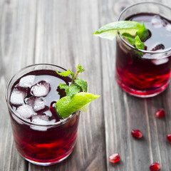 
Pomegranate cocktail with pomegranate seeds, lime and mint. alcoholic and non-alcoholic