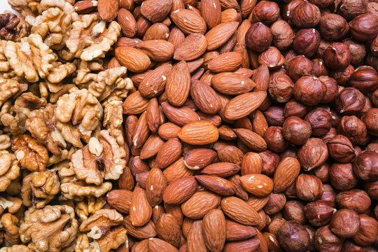 Peeled Almonds, Hazelnuts And Walnuts Kernel Background Or Textu