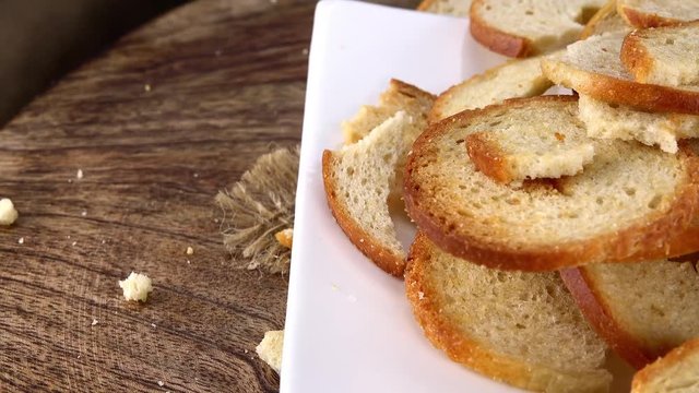 Not loopable Bread Chips (4K footage) on a rotating wooden plate