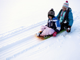 Kids Sledding Down Snow Hill on Sled Fast Speed