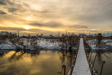 Obraz premium sunset on the river bridge
