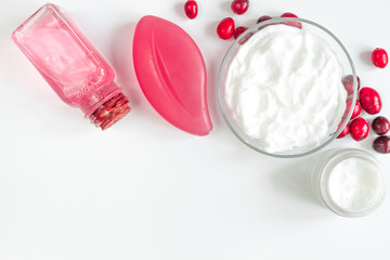 organic cosmetics with extracts of berries white background top view