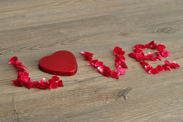 Valentines day. The word love spelled with rose petals