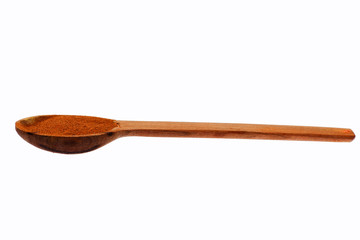 brown cinnamon in wooden spoon