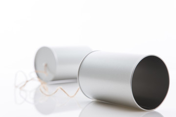 Tin cans telephone on white background