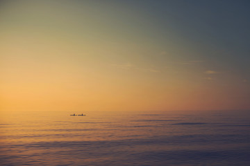 Fototapeta premium Kayaking into the sunset