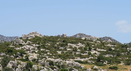 Fototapeta premium Lykian Rock Tombs at the Ruins of the Sunken City Simena near Kekova Island, Turkey