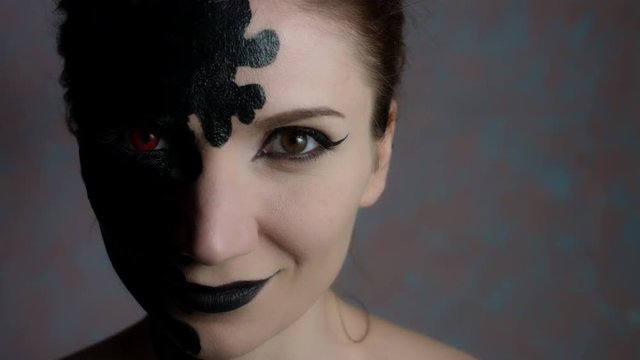 4k Shot of a Woman with Halloween Make-up Smiling Evil