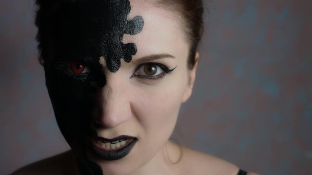 4k Shot of a Woman with Halloween Make-up Making Evil Face