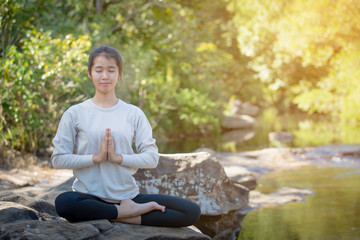 Naklejka na ściany i meble asian woman Yoga - relax in nature