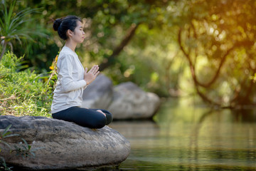 asian woman Yoga - relax in nature