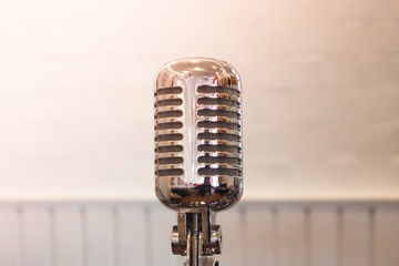 Vintage silver microphone with blurred background