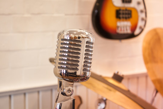 Vintage silver microphone with blurred background
