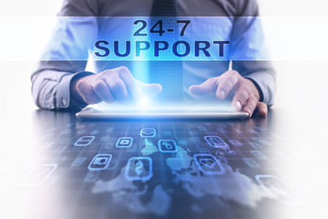 Fototapeta na wymiar 24-7 support concept. Businessman working with modern tablet pc.