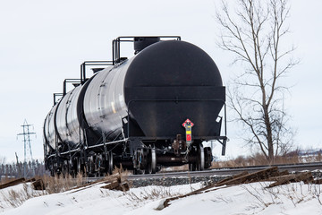 Black Tank Cars Curving Around a Corner