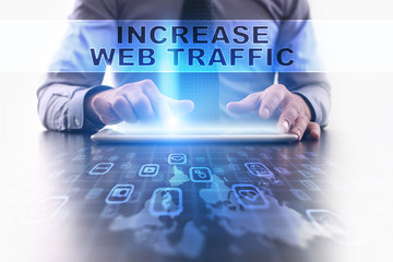 Fototapeta na wymiar increase web traffic concept. Businessman working with modern tablet pc.