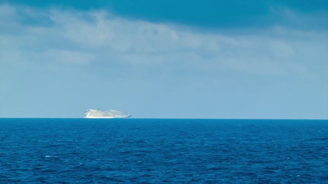 A Cruise Ship alone on the Ocean Horizon Sailing on the Atlantic towards the Caribbean