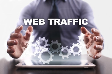 Fototapeta na wymiar Businessman is using tablet pc and selecting web traffic.