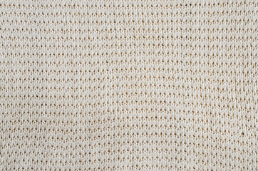 Vintage Beige Knitted Fabric Texture. Crochet Warm Woolen Yarn Background.