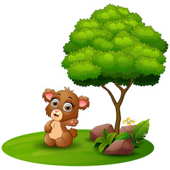 Cartoon bear waving hand under a tree on a white background