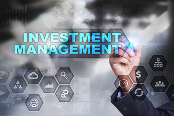 Businessman is drawing on virtual screen. investment management concept.