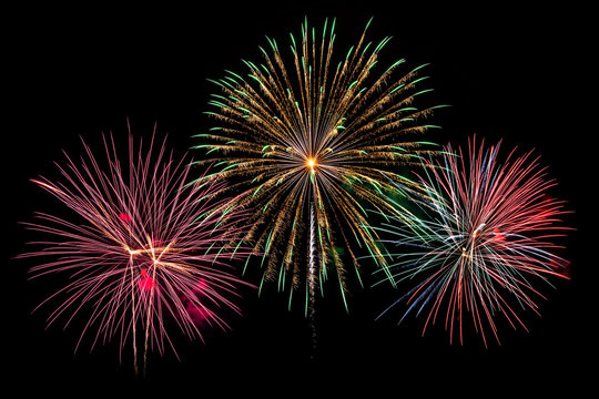 Fireworks of various colors isolated on black background