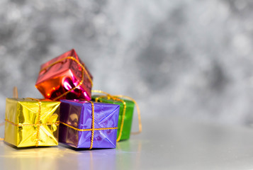 Gift Box And Baubles On Snow With Shiny Background 