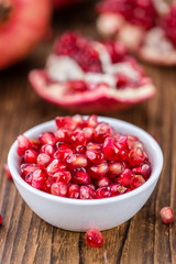 Wooden table with Pomegranate (selective focus)