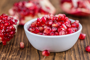 Wooden table with Pomegranate (selective focus)